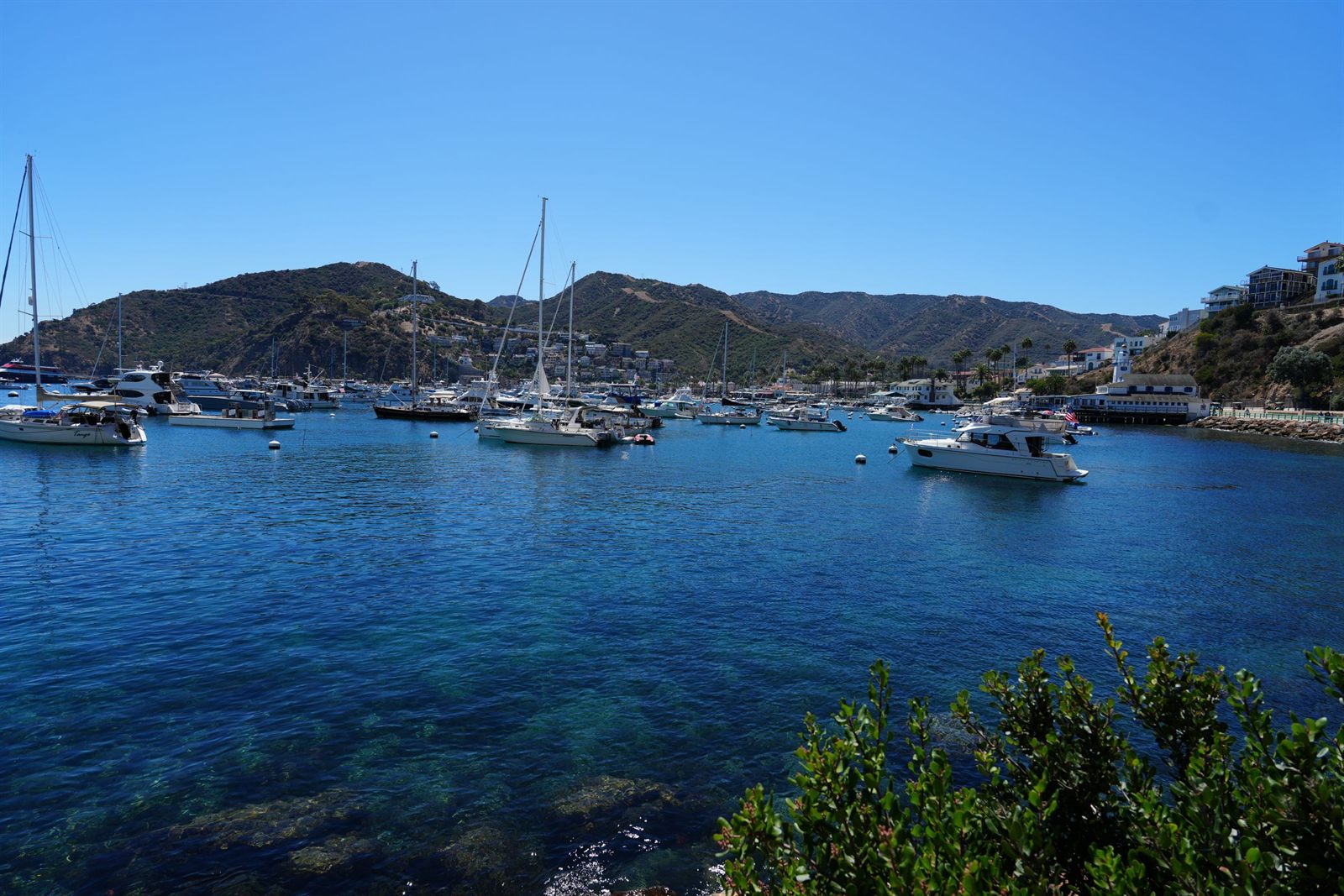Boats at anchor in a calm island bay
